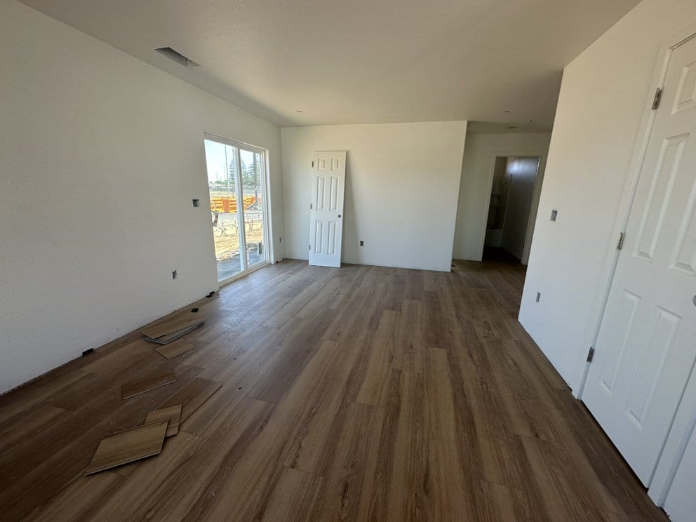 Finished interior repaint with new luxury vinyl plank flooring in Sacramento