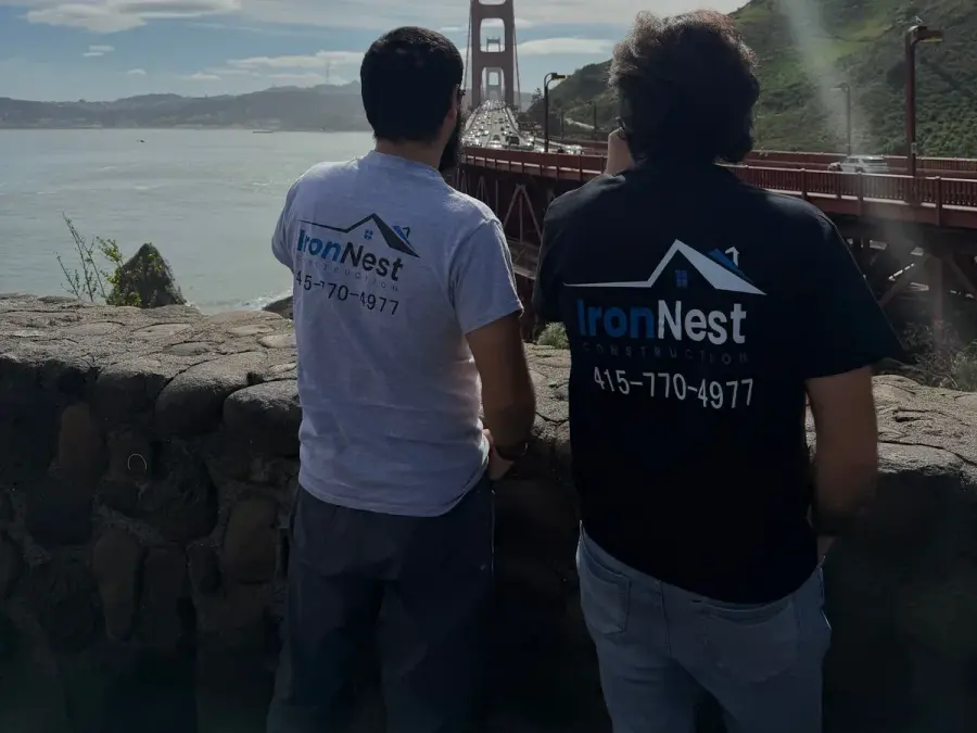 IronNest Construction crew in branded shirts looking out at the Golden Gate Bridge